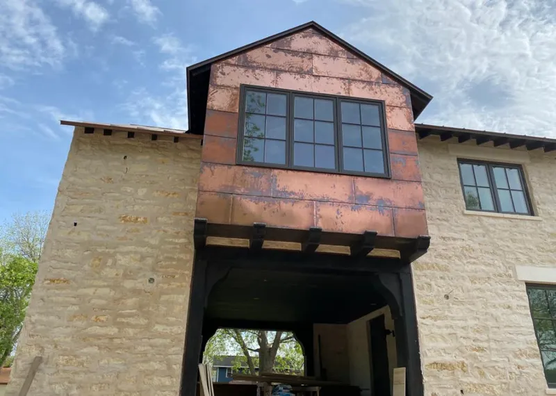 Copper metal panel facade on a stone building for Skylight Installation in Lititz