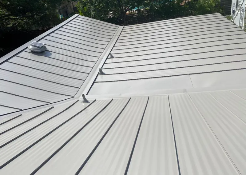 Solar attic fan installed on a metal roof for Roof Ventilation in Lititz